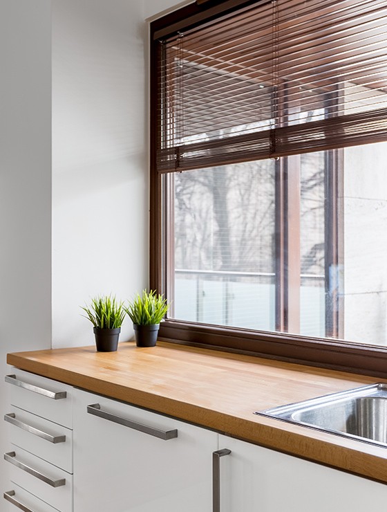 Large white aluminium window in bedroom